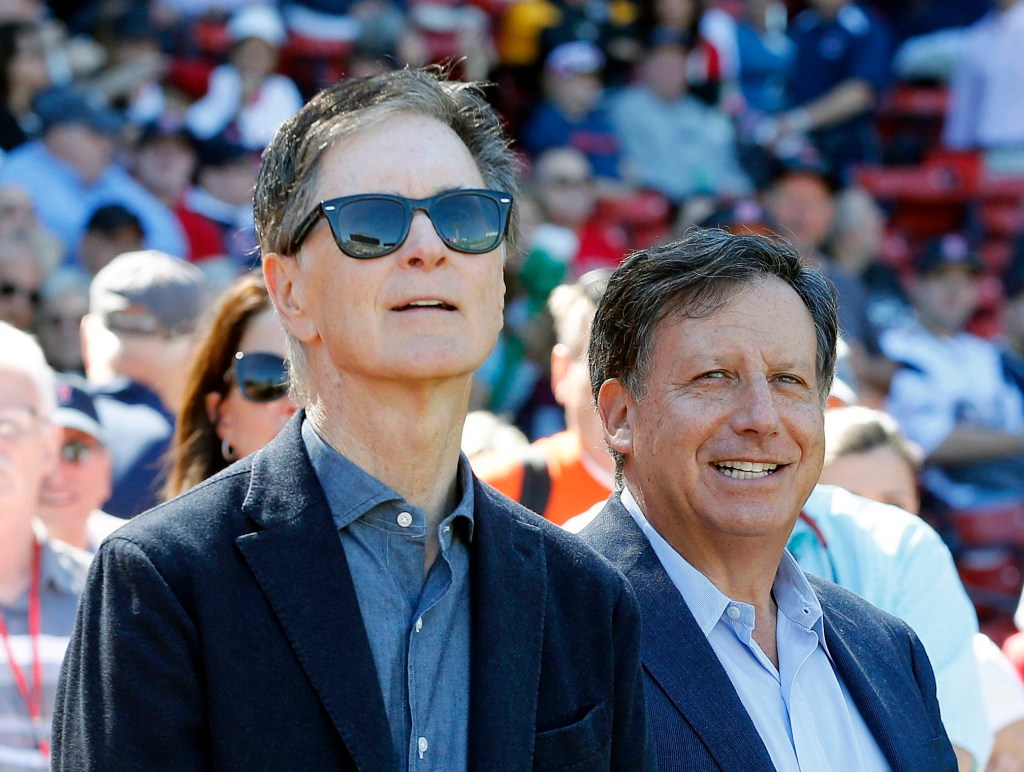 Red Sox owners John Henry and Tom Werner at a baseball game.