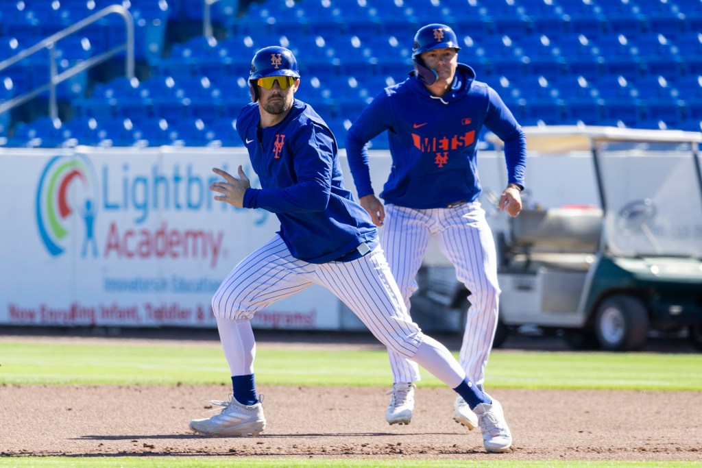 New York Mets infielder Jackson Cluff (l.) runs the bases during Spring Training at Clover Field, Tuesday, Feb. 24, 2026, in Port St. Lucie