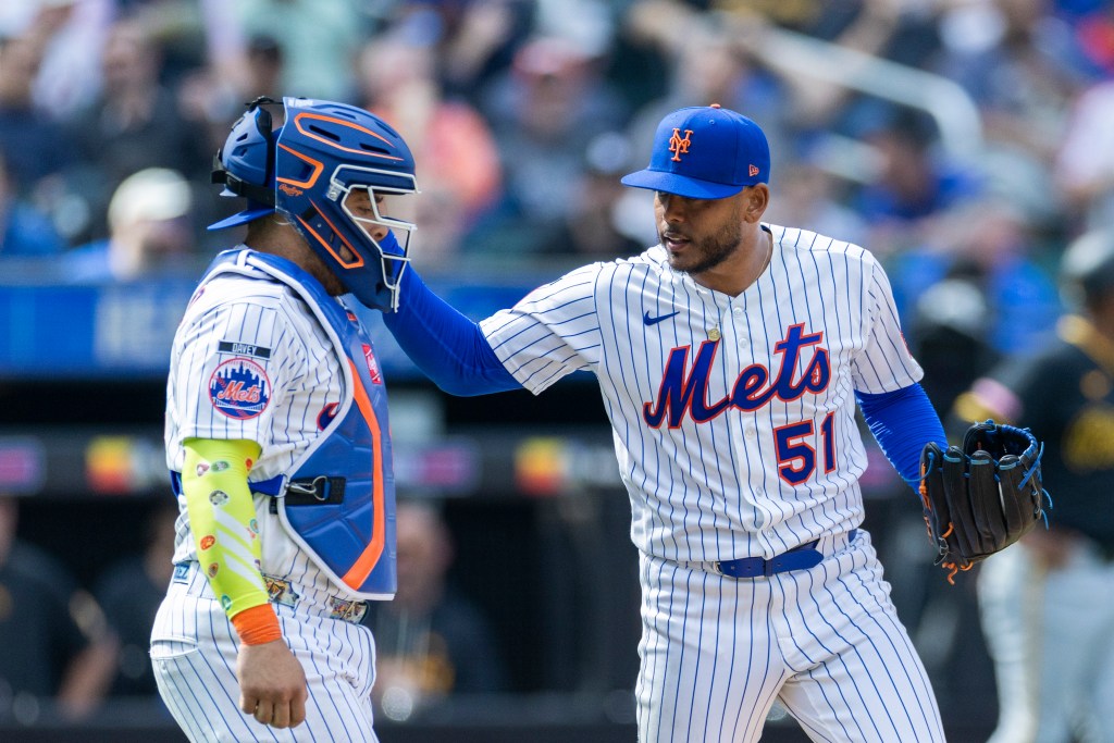New York Mets pitcher Freddy Peralta (51) greets New York Mets catcher Francisco Alvarez (4) during the fifth inning on Opening Day at Citi Field, Thursday, March 26, 2026, in Queens, NY.