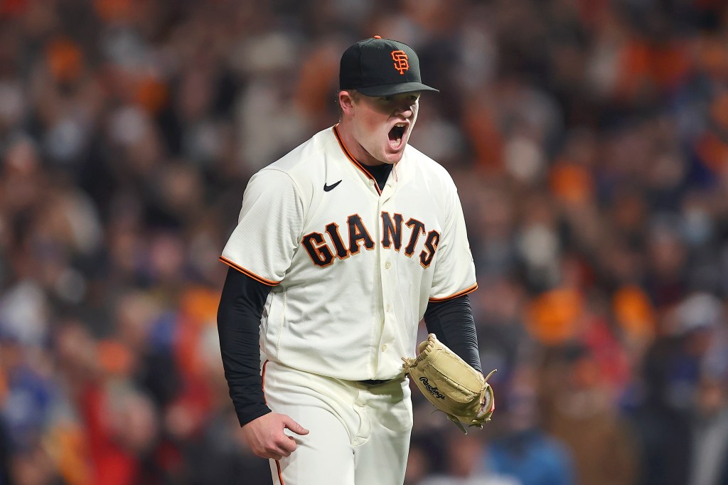 San Francisco Giants pitcher Logan Webb reacts after striking out Los Angeles Dodgers' Trea Turner during the sixth inning of Game 1 of a baseball National League Division Series Friday, Oct. 8, 2021, in San Francisco. (AP Photo/John Hefti)