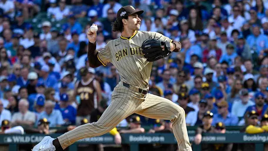 Cease throws a baseball in a grey pinstripe unifor