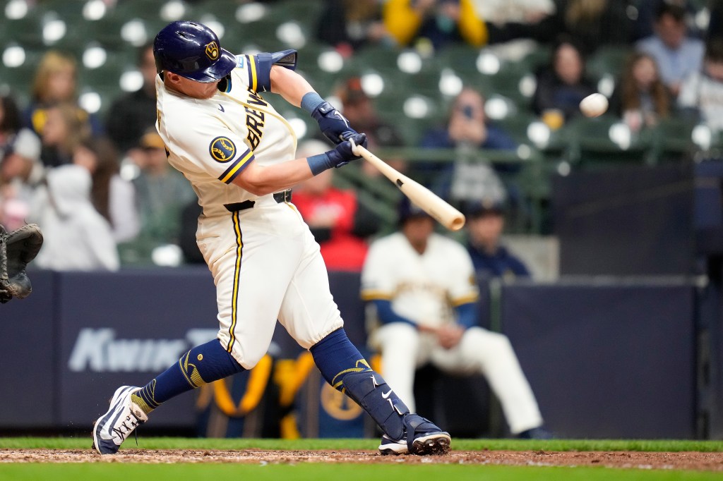 Andrew Vaughn #28 of the Milwaukee Brewers hits a solo home run in the sixth inning against the Cincinnati Reds during the exhibition game at American Family Field on March 23, 2026 in Milwaukee, Wisconsin. 
