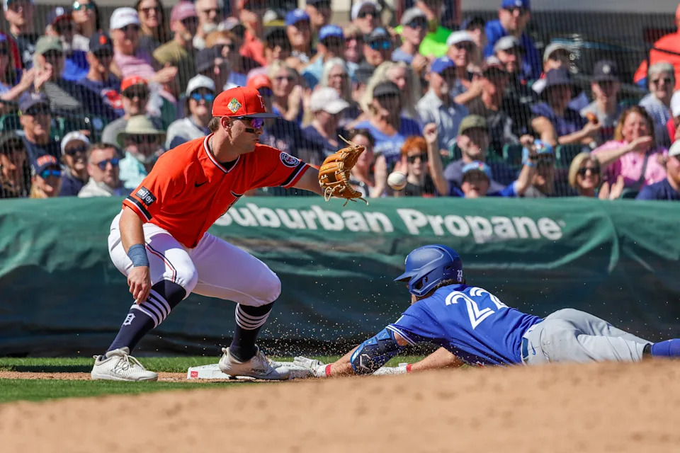 Feb 25, 2026; Lakeland, Florida, USA; Toronto Blue Jays second baseman Ernie Clement (22) slides safe into third during the third inning against the Detroit Tigers at Publix Field at Joker Marchant Stadium. Mandatory Credit: Mike Watters-Imagn Images | Mike Watters-Imagn Images