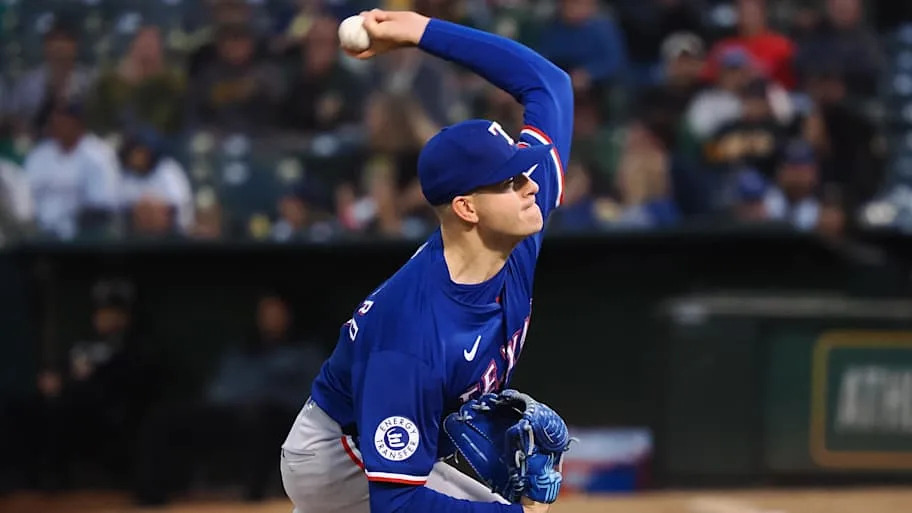 Texas Rangers starting pitcher Cody Bradford throws a baseball.