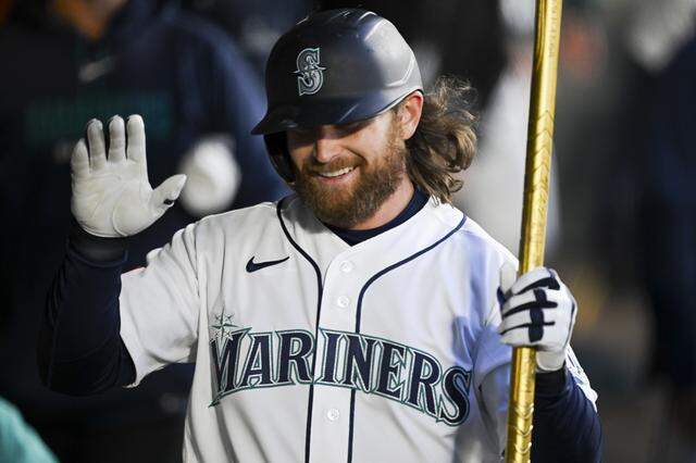 New Mariners leadoff batter Brendan Donovan (33) celebrates his solo home run on his first at-bat as a Mariner during the first inning of the opening day game against the Cleveland Guardians at T-Mobile Park, on Thursday, March 26, 2026, in Seattle.