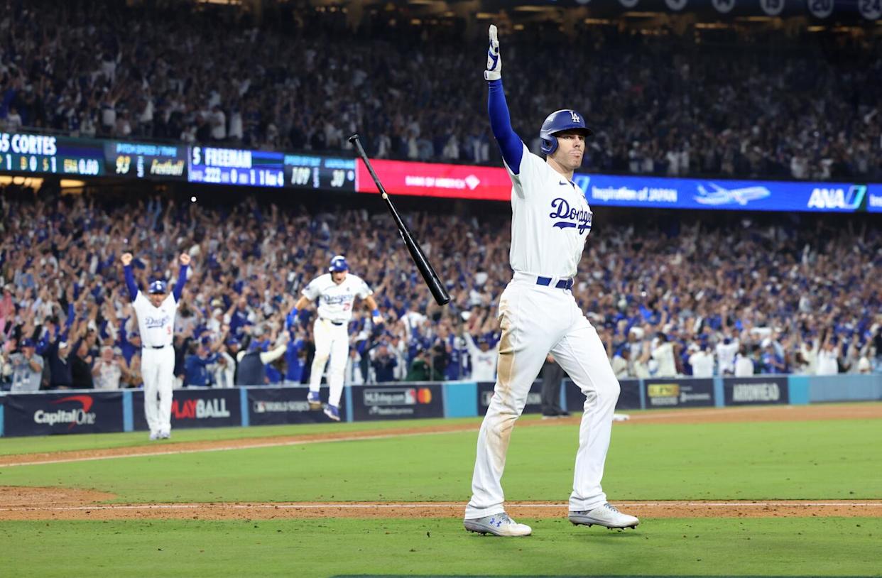Freddie Freeman tosses his bat after hitting a walk-off grand slam in Game 1 of the 2024 World Series.