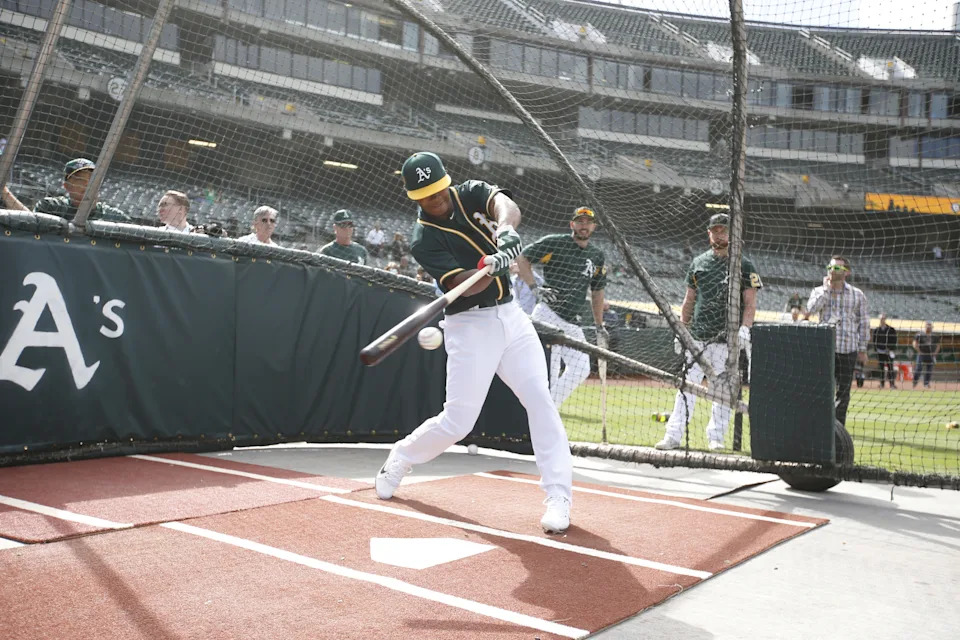 OAKLAND, CA - JUNE 15: First round draft pick Kyler Murray of the Oakland Athletics takes batting practice after signing his contract at the Oakland Alameda Coliseum on June 15, 2018 in Oakland, California. (Photo by Michael Zagaris/Oakland Athletics/Getty Images)