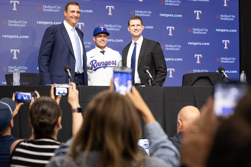 Rangers new Manager Skip Schumaker, center, poses for a photo with President of Baseball...