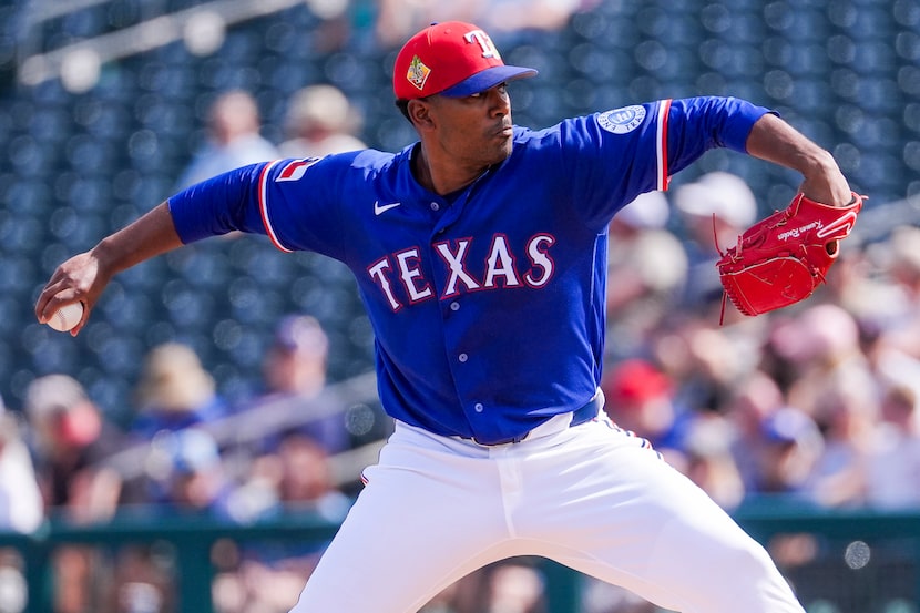 Texas Rangers pitcher Kumar Rocker delivers during the second inning of a spring training...