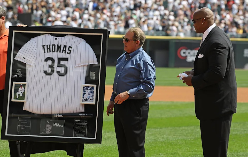 White Sox chairman Jerry Reinsdorf makes a presentation to Thomas on his retirement in August 2010, when his number 35 shirt was retired as a tribute to his achievements (Getty Images)