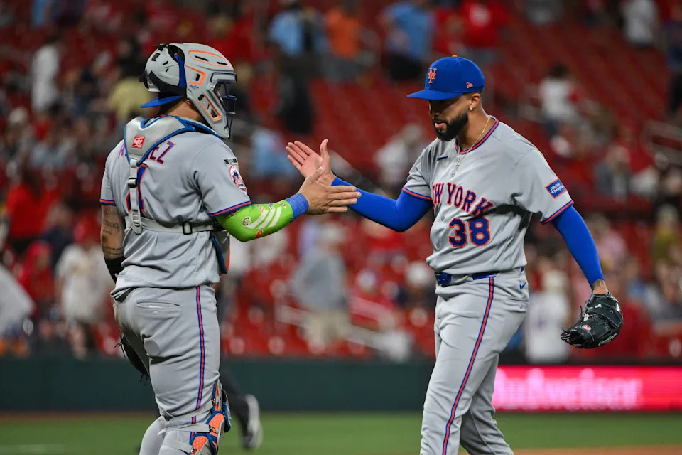 New York Mets pitcher Devin Williams (38) celebrates with catcher Francisco Alvarez (4) after the Mets defeated the St. Louis Cardinals on March 30, 2026, at Busch Stadium.