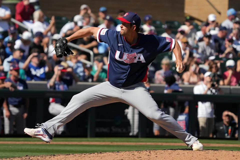 United States pitcher Clayton Kershaw (22) throws against the Colorado Rockies in the third inning at Salt River Fields.