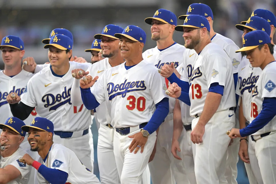 Mar 27, 2026; Los Angeles, California, USA; Los Angeles Dodgers manager Dave Roberts (30) poses with players during the World Series ring ceremony before the game against the Arizona Diamondbacks at Dodger Stadium. Mandatory Credit: Jayne Kamin-Oncea-Imagn Images