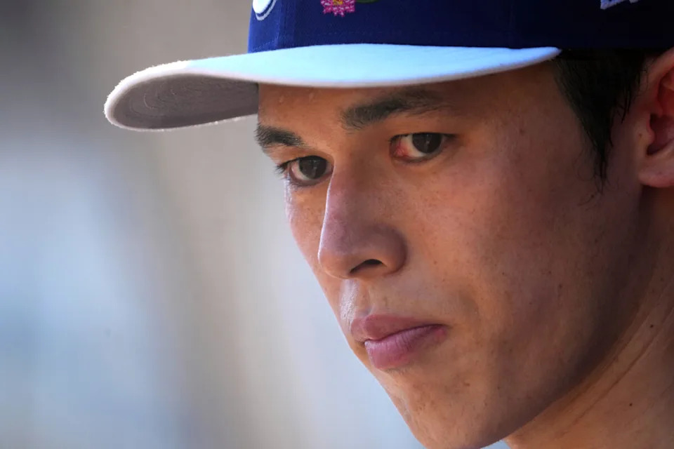 Mar 3, 2026; Goodyear, Arizona, USA; Los Angeles Dodgers starting pitcher Roki Sasaki (11) looks on against the Cleveland Guardians during the first inning at Goodyear Ballpark. Mandatory Credit: Joe Camporeale-Imagn Images