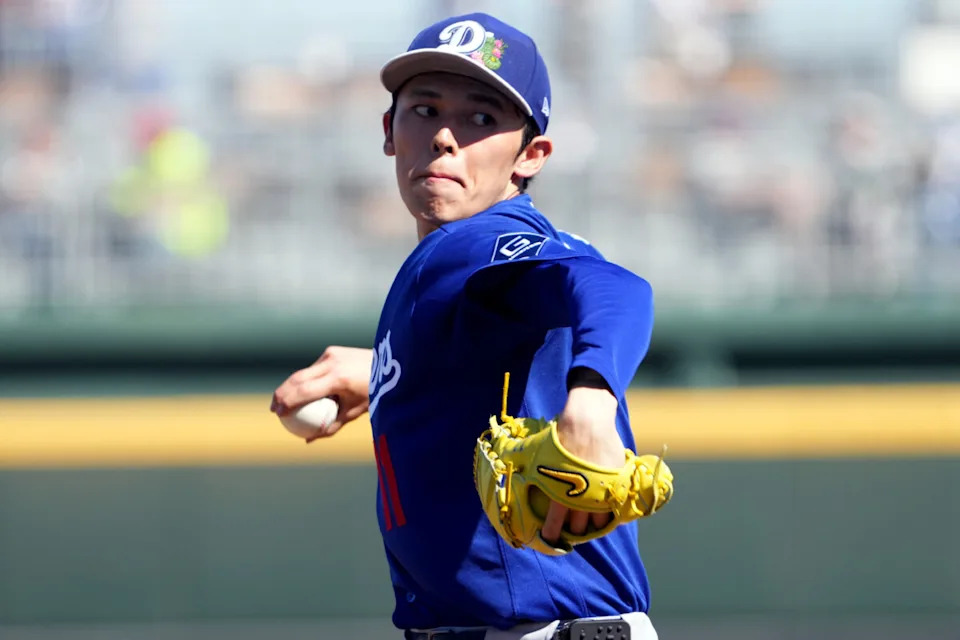 Los Angeles Dodgers starting pitcher Roki Sasaki (11) pitches against the Cleveland Guardians during the third inning at Goodyear Ballpark.