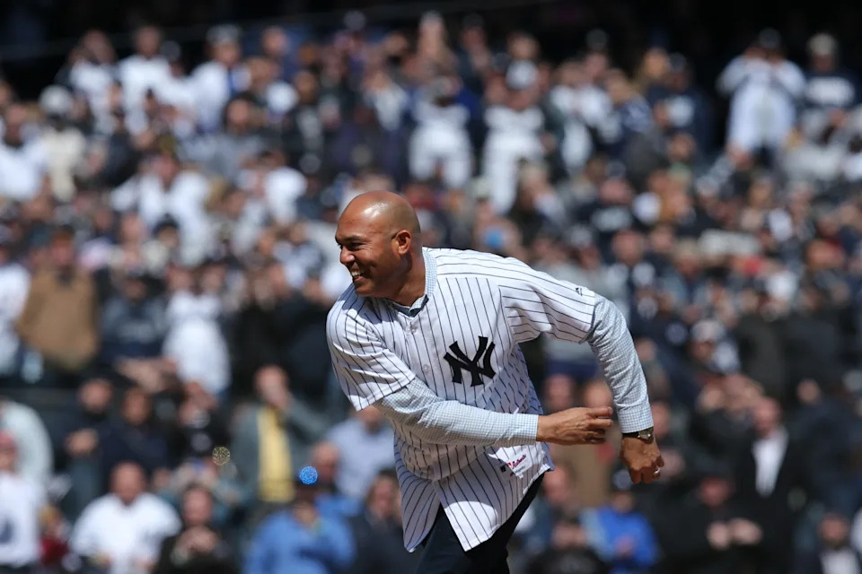 Former New York Yankees pitcher Mariano Rivera throws out the ceremonial first pitch.