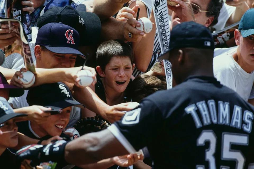 Thomas with fans during a game against the California Angels at Anaheim Stadium in California in August 1994 (Getty Images)