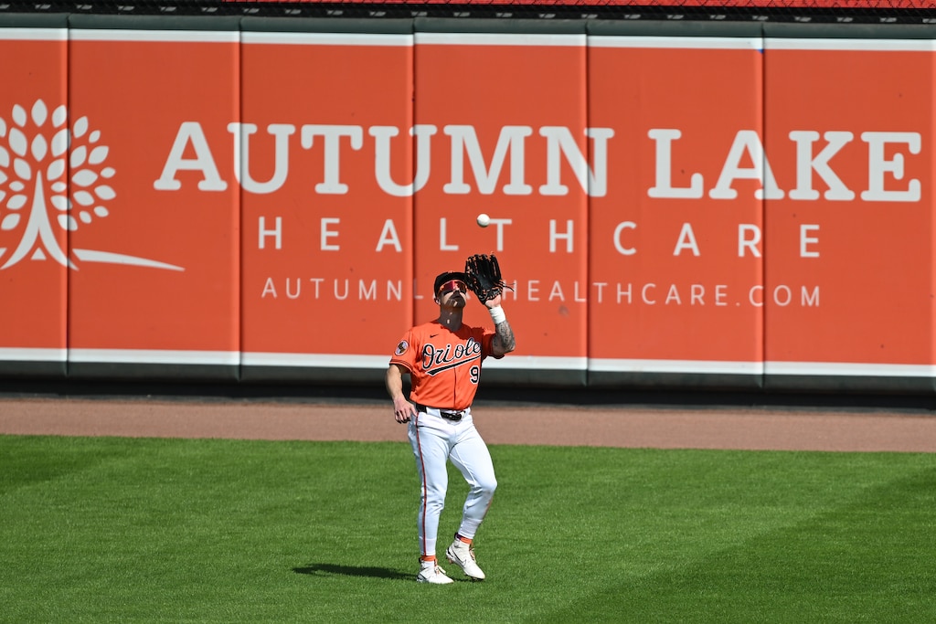Baltimore Orioles right fielder Tyler O'Neill (9) catches a fly ball hit by Washington Nationals’ CJ Abrams during the sixth inning of an exhibition baseball game, Sunday, March 22, 2026, in Baltimore.