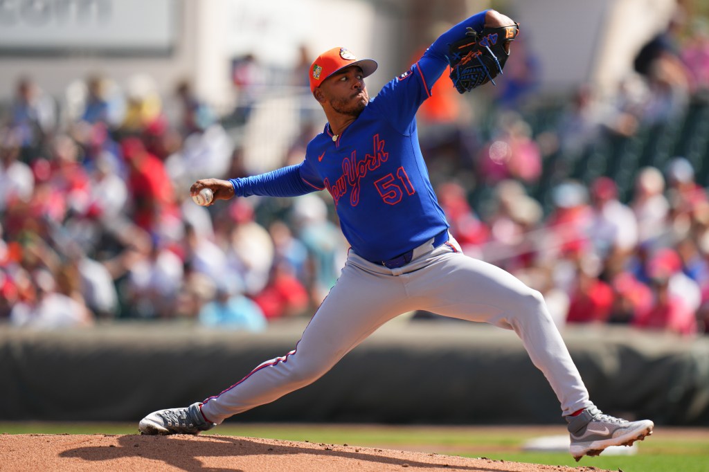 Freddy Peralta of the New York Mets pitching against the St. Louis Cardinals.