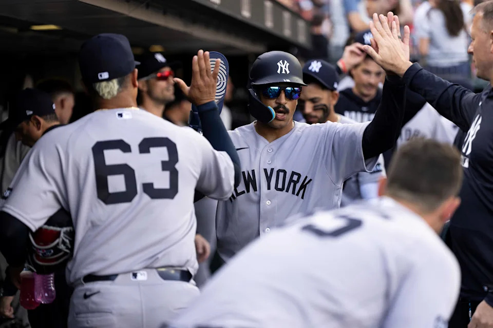 Mar 28, 2026; San Francisco, California, USA; New York Yankees center fielder Trent Grisham (12) is congratulated by teammates after scoring a run against the San Francisco Giants in the third inning at Oracle Park. Mandatory Credit: Cary Edmondson-Imagn Images