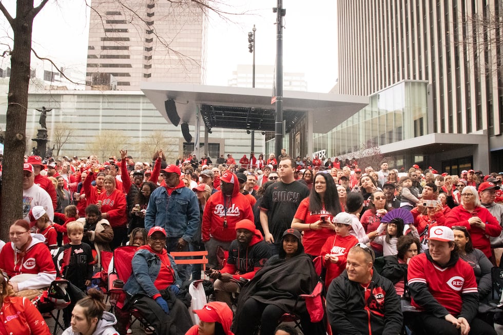Reds fans line up in downtown and Over-the-Rhine for one of Cincinnati's biggest holidays:...