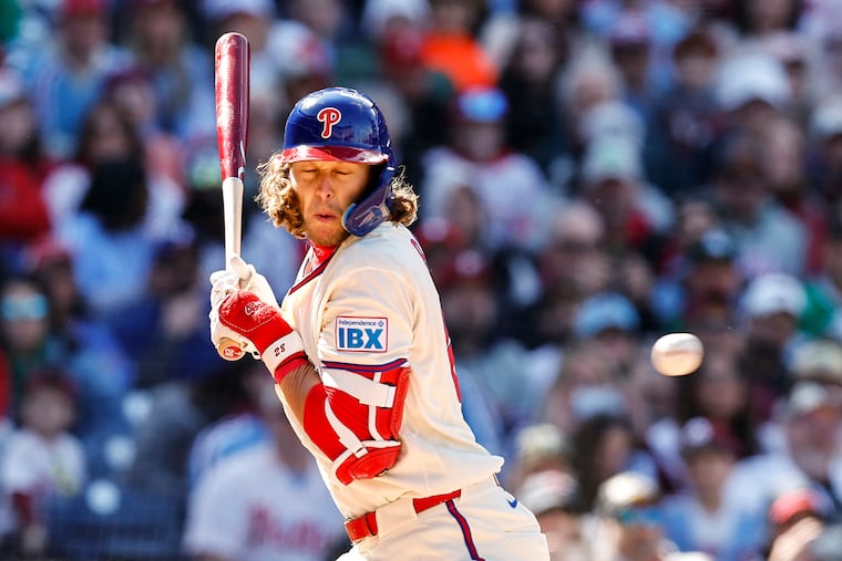 Philadelphia Phillies third baseman Alec Bohm gets hit by a pitch during the sixth inning.