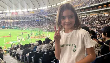 Florence Kennelly, the beloved daughter of Australian national team player. Her T-shirt reads "LET