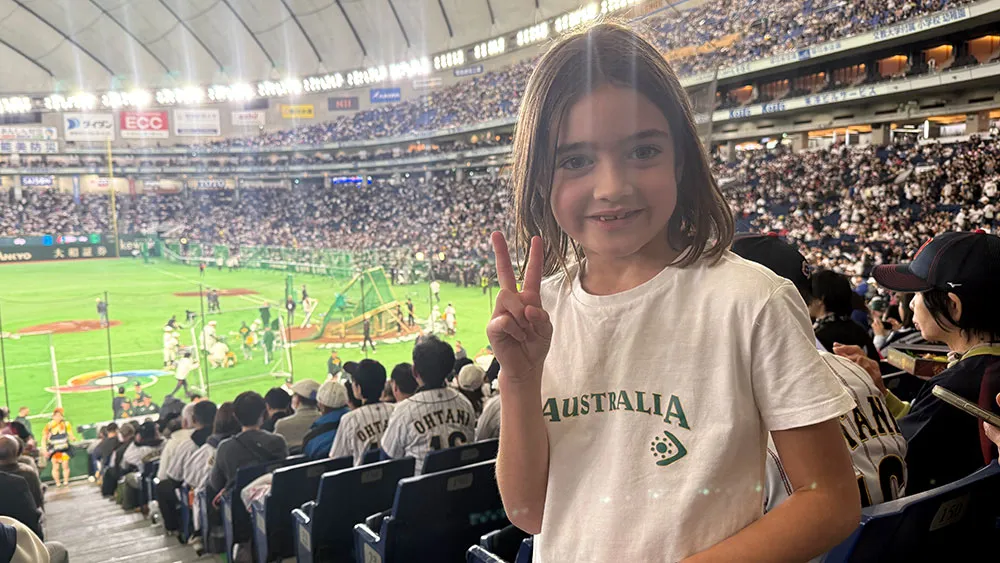 Florence Kennelly, the beloved daughter of Australian national team player. Her T-shirt reads "LET