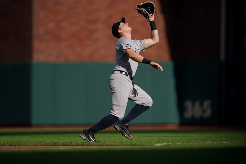 Mar 28, 2026; San Francisco, California, USA; New York Yankees first baseman Ben Rice (22) catches a fly ball against the San Francisco Giants in the second inning at Oracle Park. Mandatory Credit: Cary Edmondson-Imagn Images
