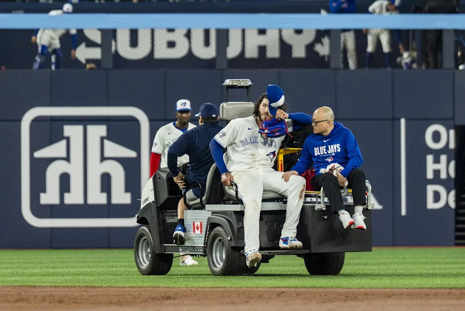 Toronto Blue Jays Cody Ponce (66) tips his cap to the fans upon leaving the game after being injured on a play at first base against the Colorado Rockies during the third inning at Rogers Centre. Kevin Sousa-Imagn Images