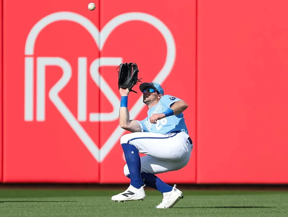 Kameron Misner #26 of the Kansas City Royals settles under a fly ball for an out during the ninth inning of a spring training game against the Chicago Cubs at Surprise Stadium on February 23, 2026 in Surprise, Arizona.
