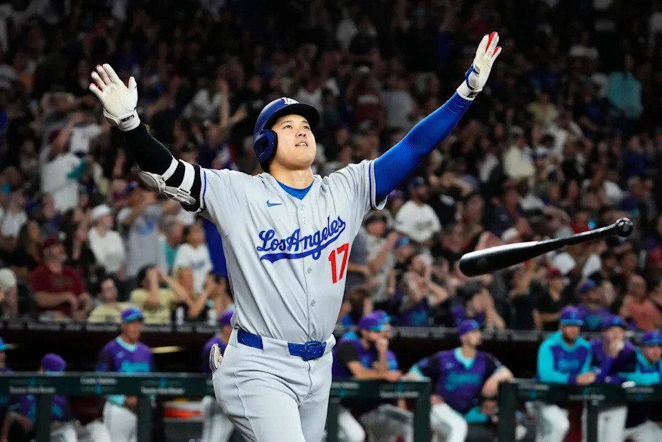 Los Angeles Dodgers Shohei Ohtani tosses his bat after hitting a three run home run against the Arizona Diamondbacks in the ninth inning at Chase Field in Phoenix on May 9, 2025. Mandatory Credit: Rob Schumacher-Arizona Republic