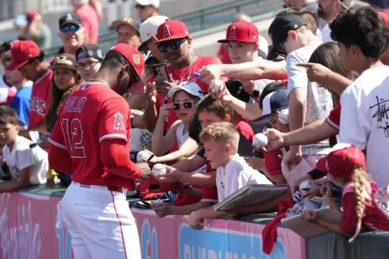 Los Angeles Angels right fielder Jorge Soler (12) signs autographs before a game against the San Diego Padres at Tempe Diablo Stadium on Mar 10, 2026.
