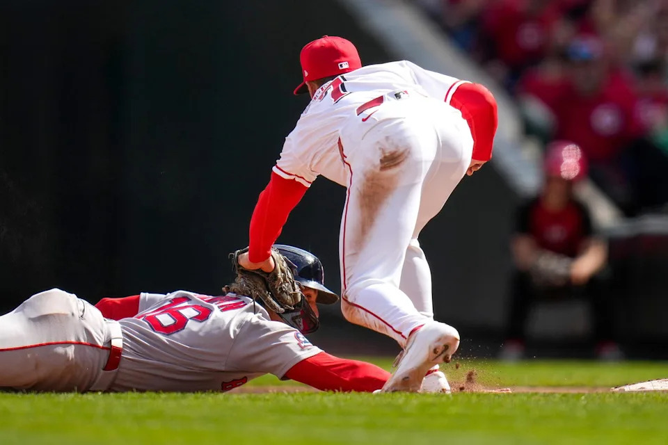 Cincinnati Reds first baseman Spencer Steer (7) gets the tag down as pitcher Tony Santillan (64) picks off Jarren Duran in the eighth inning of the MLB Interleague game between the Cincinnati Reds and the Boston Red Sox at Great American Ball Park in downtown Cincinnati on Sunday, March 29, 2026. The game was scoreless after three innings. The Reds won 3-2 to take the season-opening series from the Red Sox. (Sam Greene/The Enquirer/USA TODAY NETWORK/Imagn Images)