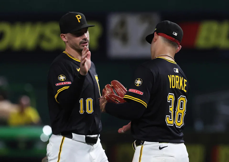 Sep 20, 2025; Pittsburgh, Pennsylvania, USA; Pittsburgh Pirates right fielder Bryan Reynolds (10) and second baseman Nick Yorke (38) celebrate after defeating the Athletics at PNC Park. Mandatory Credit: Charles LeClaire-Imagn Images