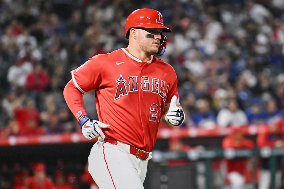 The Los Angeles Angels center fielder Mike Trout (27) hits a single during a Spring Training Game against The Los Angeles Dodgers, March 22nd, 2026 in Anaheim, California.