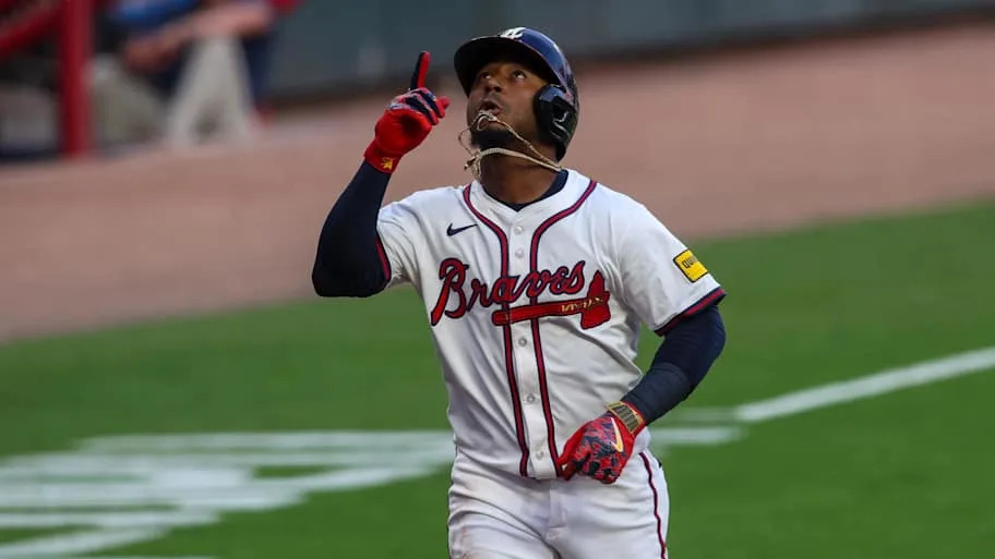 Ozzie Albies celebrates after a home run against the Chicago Cubs in the first inning at Truist Park.