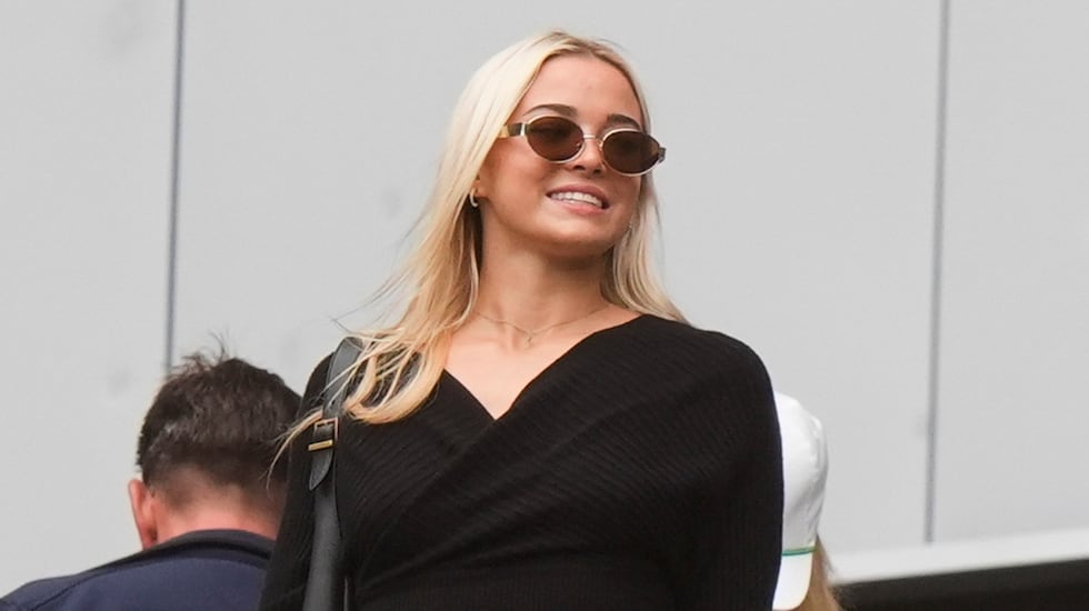 Livvy Dunne watches teams warm up before a baseball game between the New York Yankees and the...