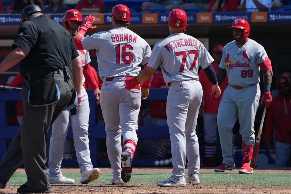 St. Louis Cardinals second baseman Nolan Gorman (16) celebrates a three-run home run against the New York Mets in the third inning with teammates Chase Davis, left, and JJ Wetherholt (77) at Clover Park. Jim Rassol-Imagn Images