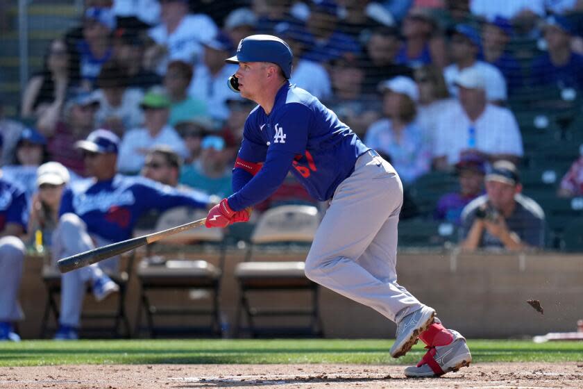 Los Angeles Dodgers' Ryan Ward watches the flight a foul ball during the second inning of a spring training baseball game against the Arizona Diamondbacks Wednesday, Feb. 25, 2026, in Scottsdale, Ariz. (AP Photo/Ross D. Franklin)