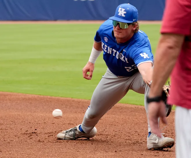 May 20, 2025; Hoover, AL, USA; Kentucky first baseman Hudson Brown (23) snags a hard-hit ball not he first baseline during the game with Oklahoma in the first round of the SEC Baseball Tournament at the Hoover Met.