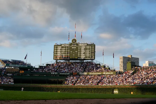 A general view of the bleachers and scoreboard during the fifth inning of a game between the Chicago Cubs and the Boston Red Sox at Wrigley Field.