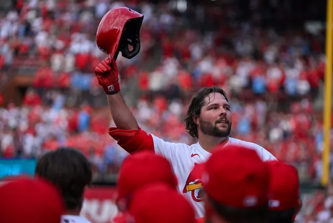 Mar 26, 2026; St. Louis, Missouri, USA; St. Louis Cardinals first baseman Alec Burleson (41) salutes the fans as he receives a curtain call after hitting a go ahead two run home run against the Tampa Bay Rays during the sixth inning at Busch Stadium.