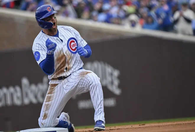 Mar 26, 2026; Chicago, Illinois, USA; Chicago Cubs first baseman Michael Busch (29) reacts after hitting a double against the Washington Nationals during the first inning at Wrigley Field.