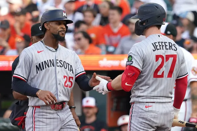 Mar 26, 2026; Baltimore, Maryland, USA; Minnesota Twins outfielder Byron Buxton (25) greeted by catcher Ryan Jeffers (27) after scoring a run during the eighth inning against the Baltimore Orioles at Oriole Park at Camden Yards.