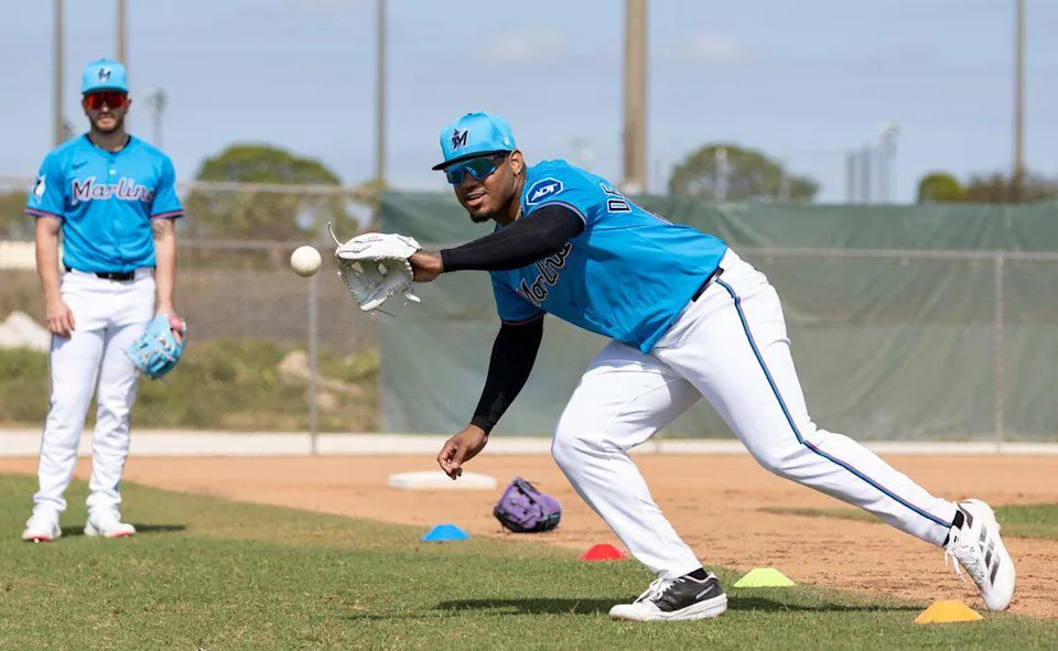 Miami Marlins third base Deyvison De Los Santos (65) catches the ball during first full-squad spring training workouts at Roger Dean Chevrolet Stadium on Monday, Feb. 17, 2025, in Jupiter, Fla.