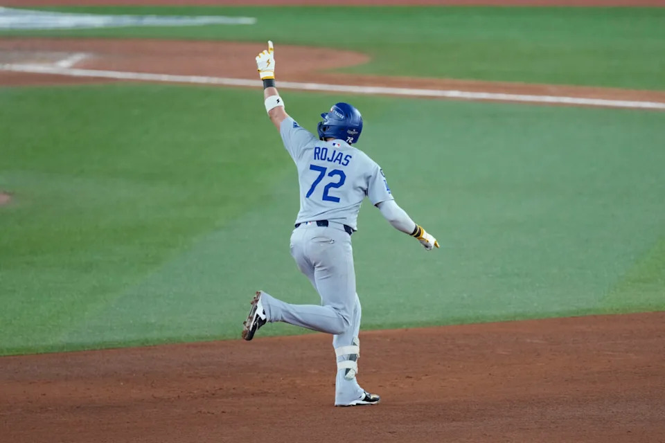 Los Angeles Dodgers second baseman Miguel Rojas (72) celebrates as he runs the bases after hitting a home run against the Toronto Blue Jays in the ninth inning during game seven of the 2025 MLB World Series at Rogers Centre.