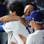 Sep 19, 2025; Los Angeles, California, USA; Los Angeles Dodgers pitcher Clayton Kershaw (22) is greeted by designated hitter Shohei Ohtani (17) after being relieved during the fifth inning against the San Francisco Giants at Dodger Stadium. Mandatory Credit: Kiyoshi Mio-Imagn Images