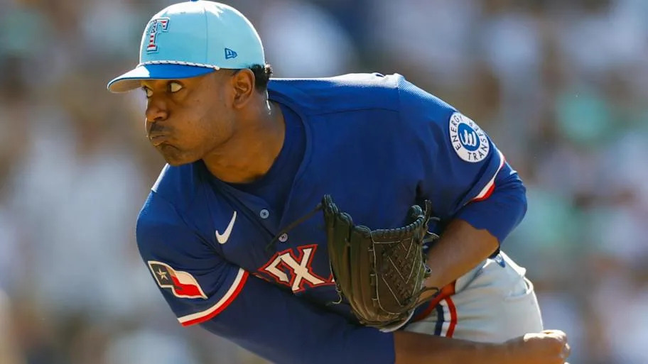 Texas Rangers pitcher Kumar Rocker throws a baseball during a game