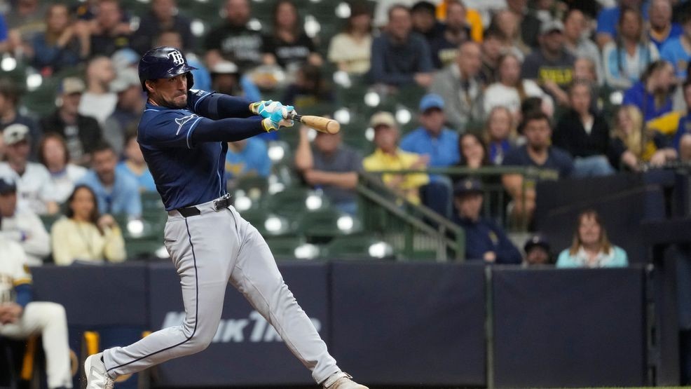 Tampa Bay Rays' Nick Fortes hits an RBI double during the ninth inning of a baseball game against the Milwaukee Brewers, Monday, March 30, 2026, in Milwaukee. (AP Photo/Aaron Gash)